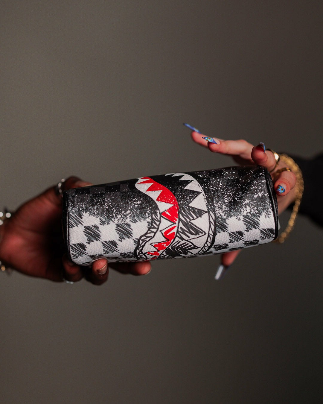 SCRIBBLE DRIBBLE CHECK POUCH | Sprayground Value Deal
