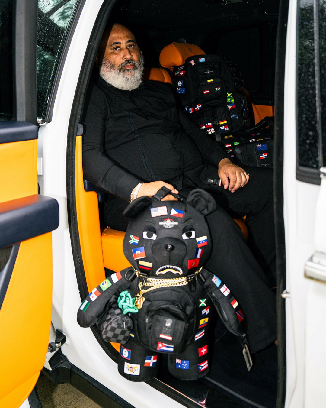 JAMES FIRST CLASS GLOBAL FLAGS MONEYBEAR BACKPACK | Sprayground Outlets