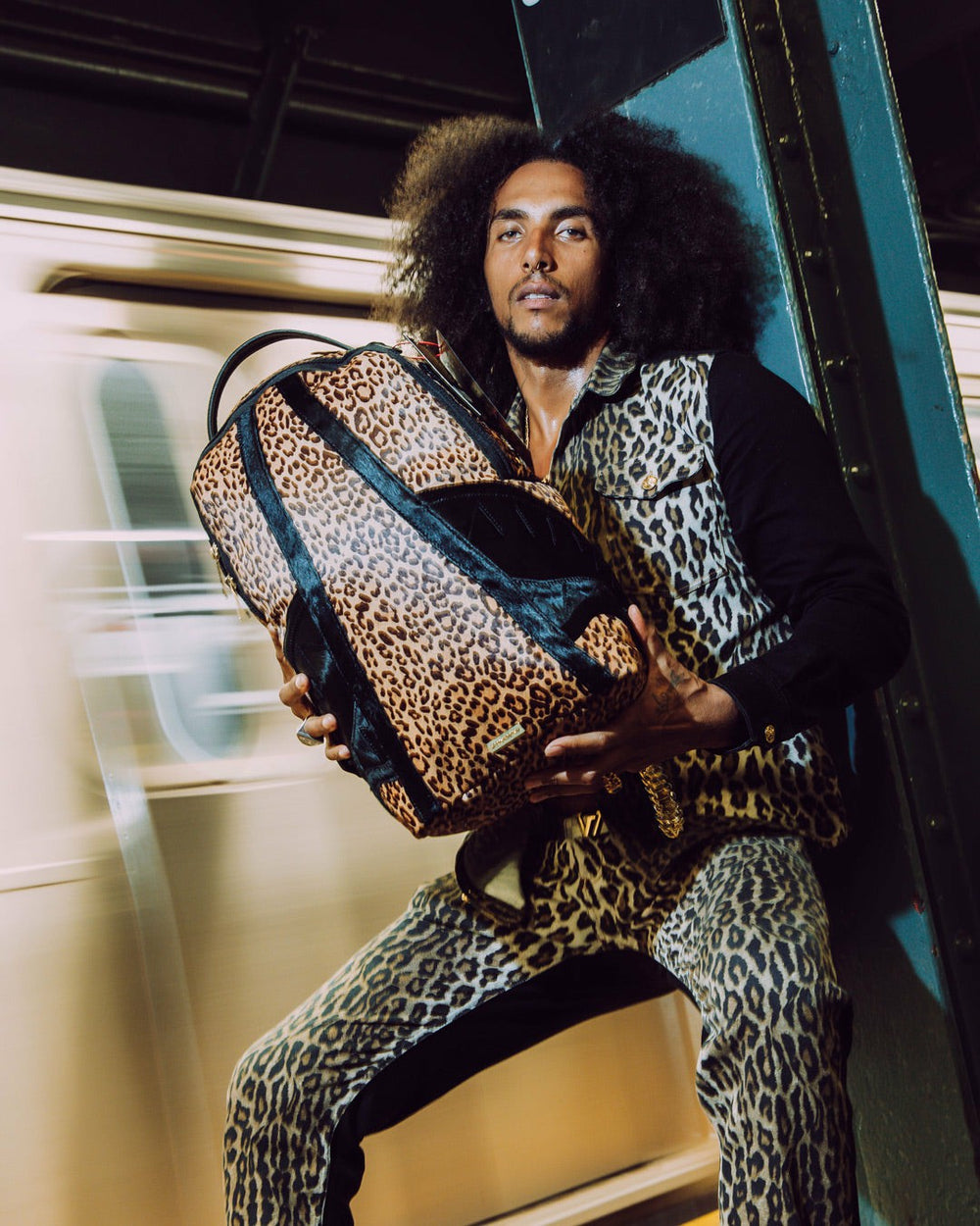 AFRICAN INTELLIGENCE 9 COURAGE LIVES ON BACKPACK - SANDFLOWER COLLAB | Sprayground Outlets