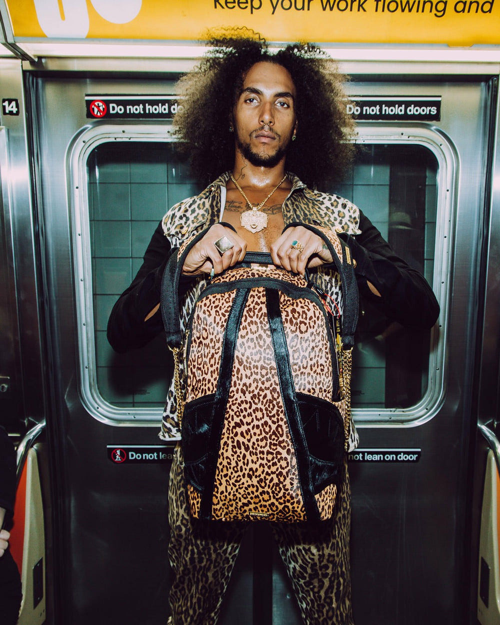AFRICAN INTELLIGENCE 9 COURAGE LIVES ON BACKPACK - SANDFLOWER COLLAB | Sprayground Outlets