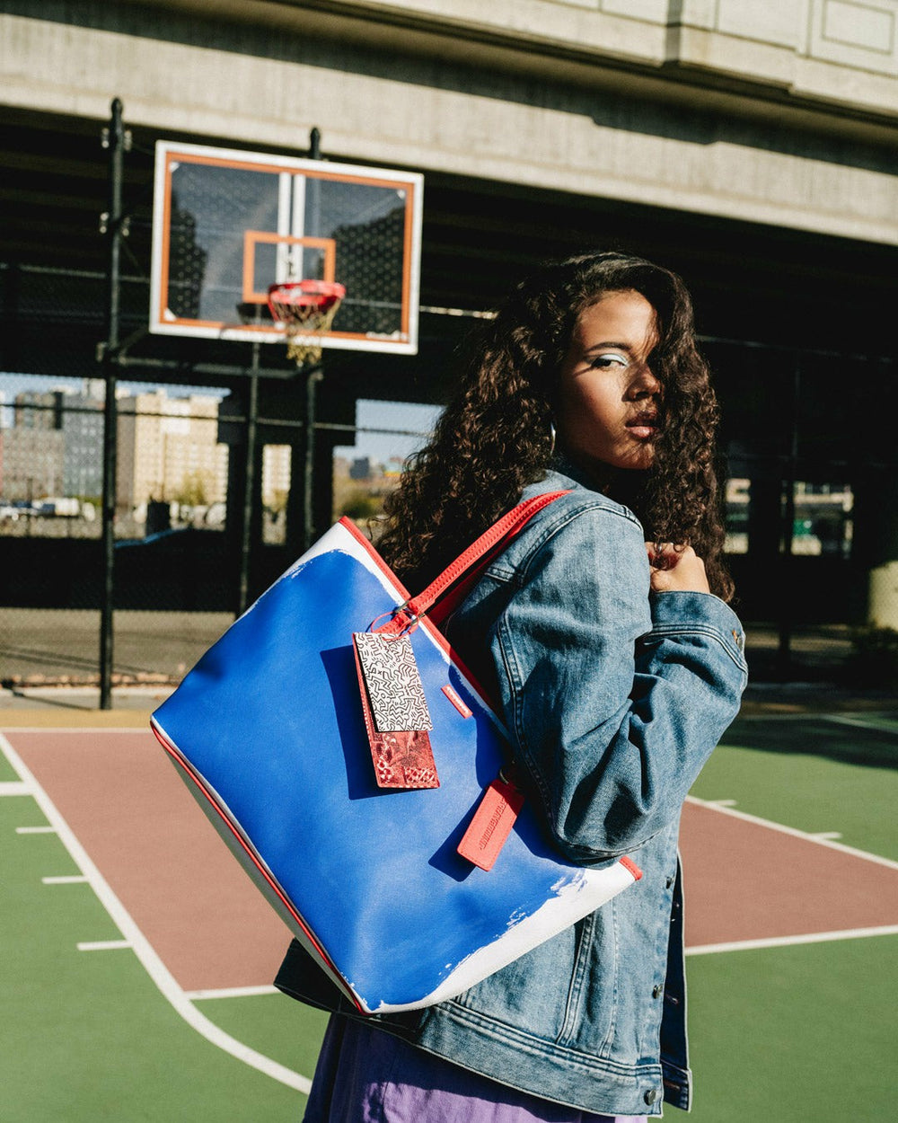KEITH HARING THE BIG BLUE PURSE ART TOTE | Sprayground Savings
