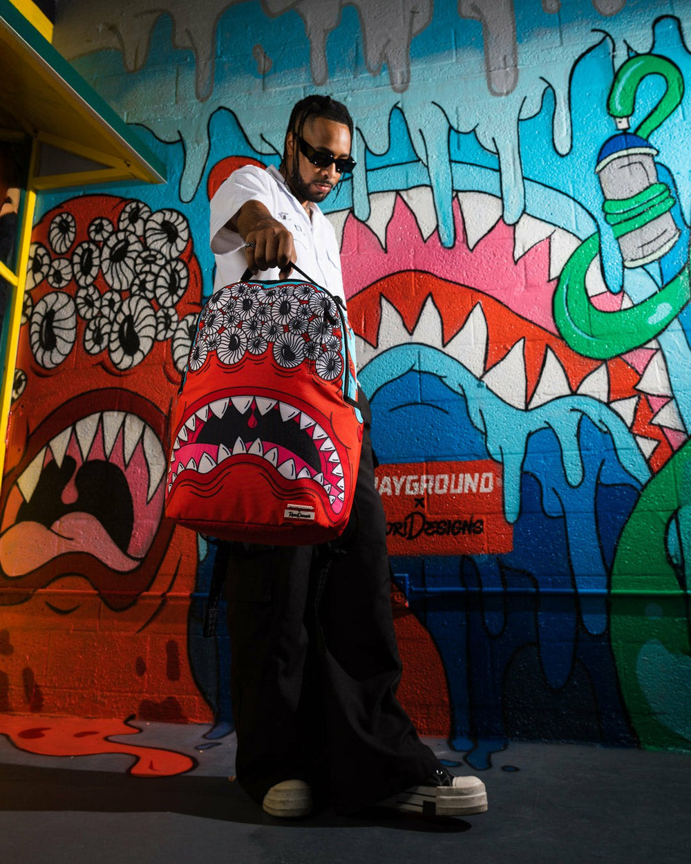 JORGE RODRIGUEZ THE ARTIST COLLAB BLINKY SHARK BACKPACK | Sprayground Savings